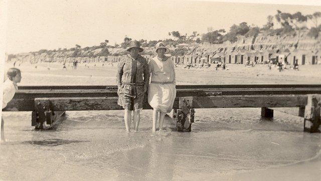 Hampton Beach, two women leaning against jetty