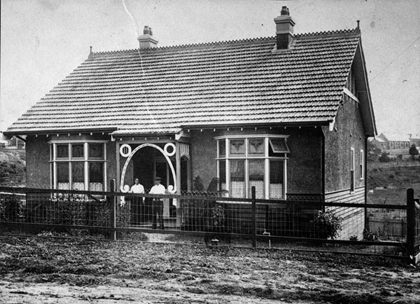 Mr & Mrs Swinton in front of their home