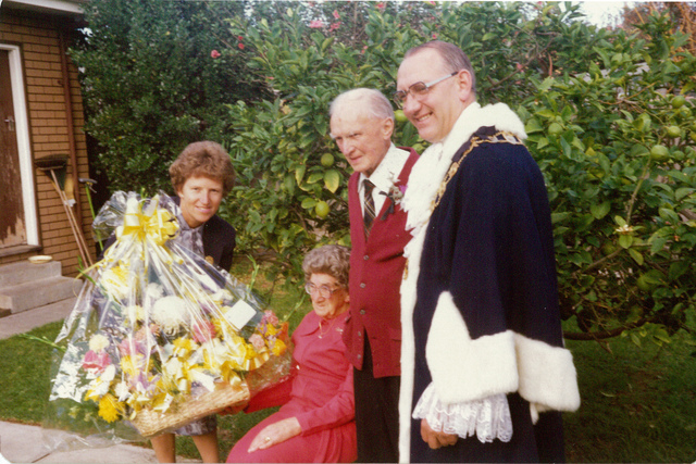 Councillor S J Clement and wife presenting flowers