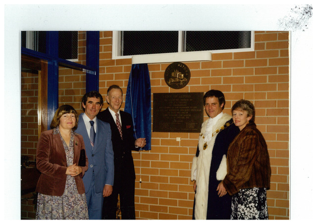 Councillor D Duane beside a City of Altona plaque commemorating the opening of an extension to the J K Grant Reserve hockey pavilion