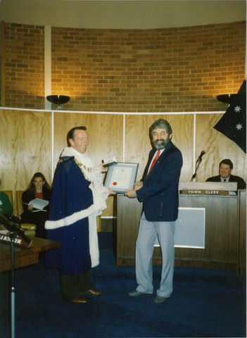 Mayor W.H. Sommers presenting an award to Barry Hansen