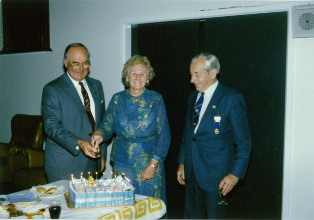 Mayor W.L.J. Crofts cutting a birthday cake