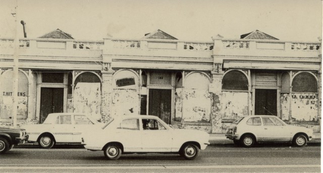 Cars outside of Victoria Street shops