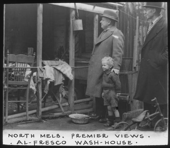 Premier Albert Dunstan views wash house