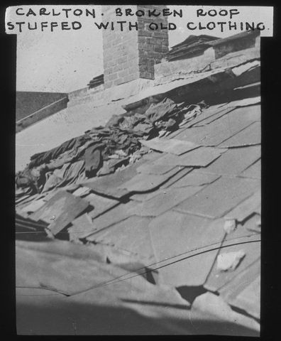 Broken roof stuffed with old clothing, Carlton