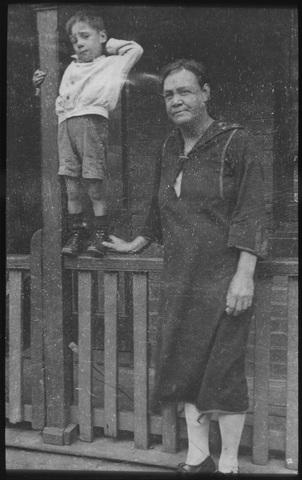 Boy on verandah, Carlton slum pocket area