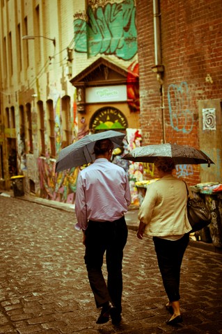 'Walking in the rain down Hosier Lane'