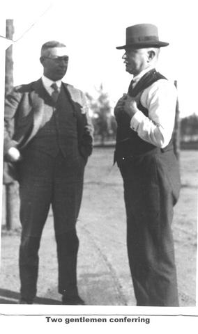 Two gentlemen conferring Mildura