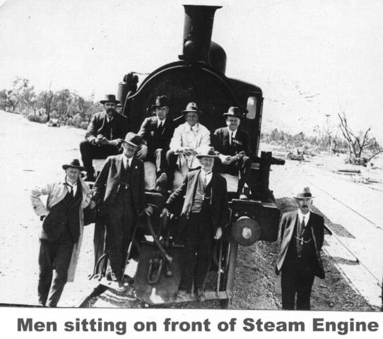 Men sitting on front of Steam Engine, Mildura.