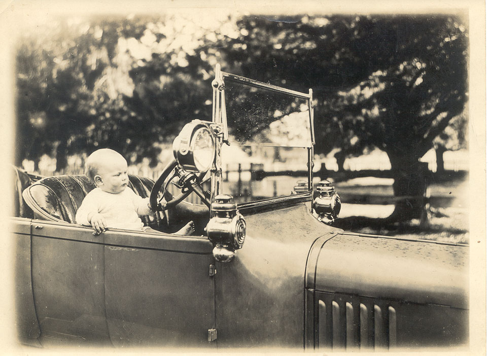 Ford car with child at wheel, Alexandra