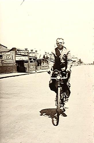 [Frederick Kalton Williams riding a bike]