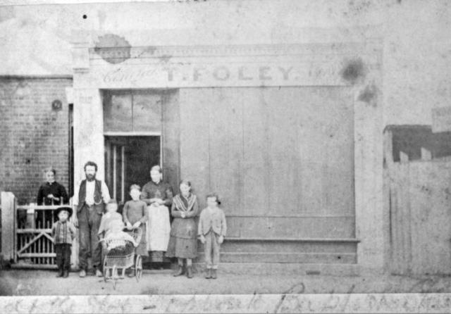 Family group outside T. Foley's