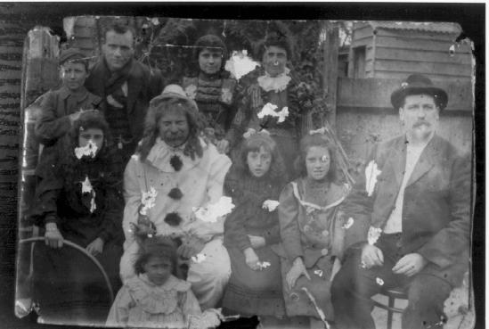 Family group with clown in back yard