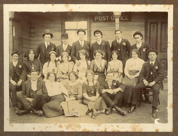 Group of young men and women outside a post office.